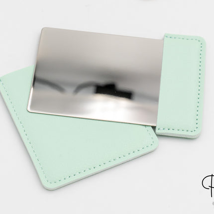 Miroir rectangulaire en acier et cuir synthétique