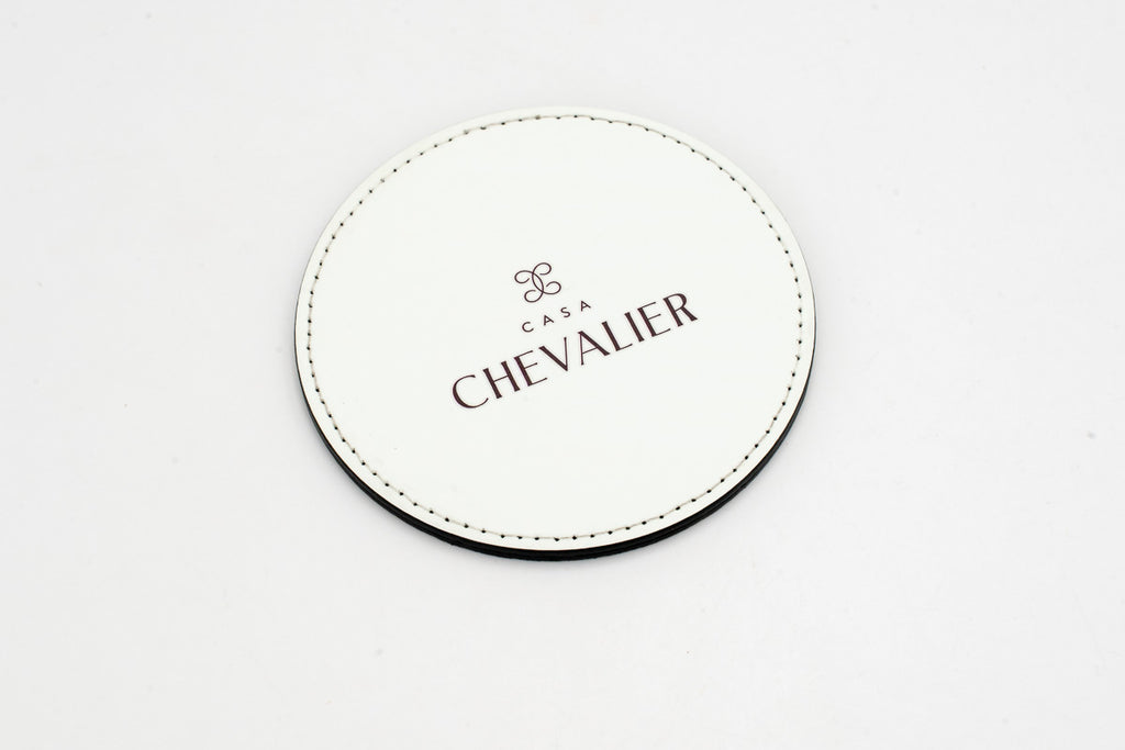 Sous-verre rond blanc avec logo Chevalier gris.