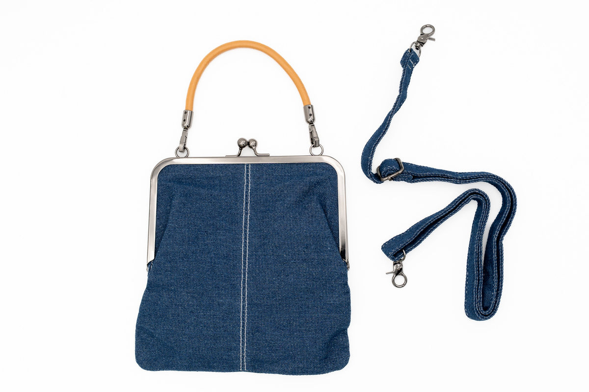 Sac à main en denim avec fermoir métallique à cadre et courte anse ocre