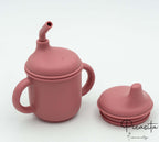 Vaso aprendizaje rosa oscuro con sistema de pajita y tapa protectora de silicona.